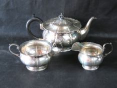A hallmarked silver tea set comprising teapot, milk and sugar bowl, makers marks for Mappin & Webb,