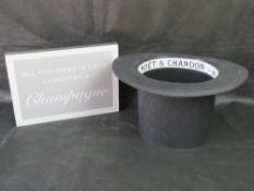 A Moet et Chandon 'top hat' ice bucket champagne cooler.