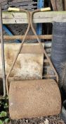 A vintage lawn roller.