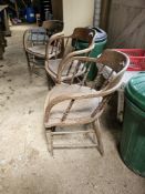 Three early 20th century spindle back smokers or elbow chairs.