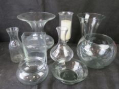 A large quantity of assorted clear glass vases, crystal candle stand, etc.
