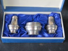 A hallmarked silver cruet set in presentation box, 53.6g / 1.73ozt.