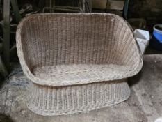A wicker conservatory seat.