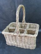 A six sectional wicker wind or bottle basket.