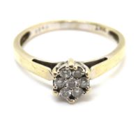 An 18ct gold and 0.25ct diamond cluster ring, hallmarked, 3.1g, size P-Q.