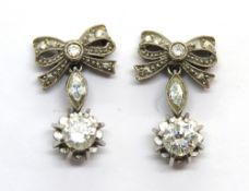 A delightful pair of diamond earrings in the form of bows,