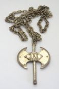 A white metal axe pendant on silver chain.