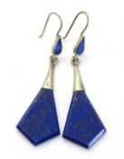 A pair of large blue stone drop earrings.