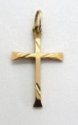 A yellow metal cross, no apparent hallmarks, 0.
