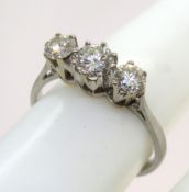 A traditional three stone diamond ring,