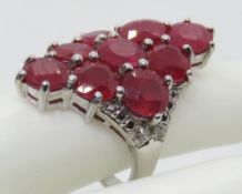 A 925 silver cocktail ring with pink stone cluster, size Q.
