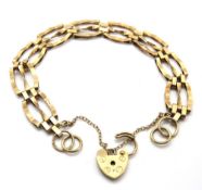 A 9ct gold three bar gate link bracelet having heart padlock clasp, hallmarked 375, 7.5g.