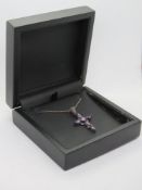 A Gothic silver crucifix set with purple stones and marcasites, 4.