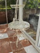 Two contemporary circular garden tables, 76cm dia and 44cm dia respectively.