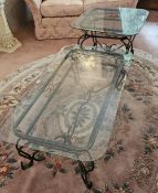 To match lot 17 - Two glass top occasional tables each raised over wrought iron base,