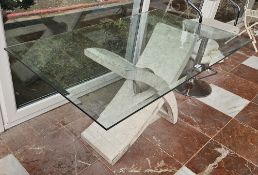 A contemporary bevelled edge glass top table 130 x 80 x 71cm.