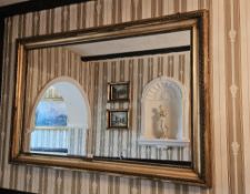 A 19th century gilded and recessed square shaped wall mirror with cup and egg decoration