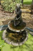 A contemporary two-tier scalloped fountain with figurine over, approx. 120cm high.