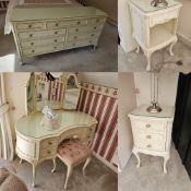 A c1960s Continental style cream bedroom suite comprising kidney shaped dressing table with