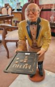 A scale model waiter figurine with 'menu' tray, 92cm high.