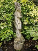 A single neoclassical style stoneware statue raised over reeded octagonal base, 128cm high