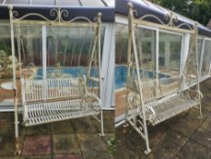 A pair of metal garden swing seats, each 150cm wide. Some rust throughout.