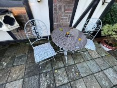 A garden bistro set comprising table and two chairs, dia 70cm.