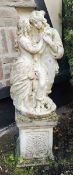 A neoclassical style garden statue comprising man and woman on plinth base, 115cm high.