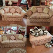 A smart pink traditional four-piece suite comprising three-seater and twin two-seater settees