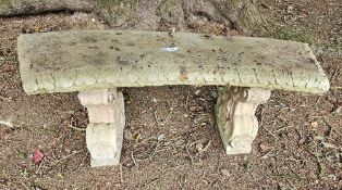 A single curved stoneware garden bench raised over twin decorative supports, 120cm wide.