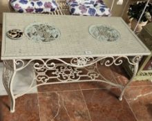 A decorative metal garden table, 100 x 50 x 55cm.