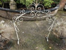 An iron decorative garden frame, standing 100cm high