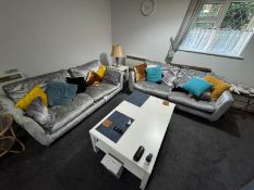 A matched pair of silvered crushed velvet settes, each with twin large loose cushions.