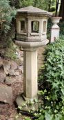 A stoneware garden 'lighthouse' raised over octagonal base, 122cm high.