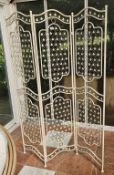 A decorative threefold metal screen, 173cm high.