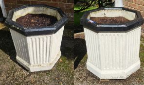 A pair of octagonal cast concrete planters 51 x 52cm.