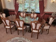 A superb quality walnut veneered extending D end ding table raised over twin reeded and shaped