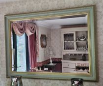 An attractive contemporary square shaped bevelled edge green painted wall mirror, 104 x 76cm