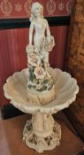 A decorative 'fountain' surmounted by female figure, 105cm high.