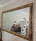 A contemporary square shaped bevelled edge wall mirror with foliate painted frame, 132 x 75cm.