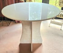 An alabaster circular table raised over x shaped base, 98cm dia, 80cm high.