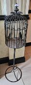 A blacksmith made freestanding candle stand in the form of a birdcage standing, 112cm high