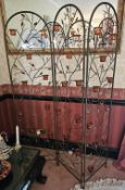 A contemporary threefold tree branch themed freestanding screen with votive candle holders,