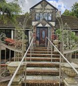 A fine pair of metal decorative gated pergolas each measuring 172cm wide, 248cm high.