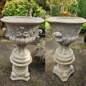 A good pair of stoneware planters each on decorative base, each standing 106cm high, 57cm dia.