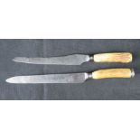 A Mappin and Webb carving knife with hallmarked silver pommel, together with another similar.
