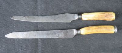 A Mappin and Webb carving knife with hallmarked silver pommel, together with another similar.