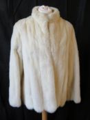 A vintage white mink coat.