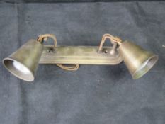 A Jim Lawrence Double Curtis antiqued brass wall light - retailing new at £200 - 'spun shades,