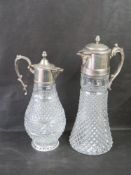 Two glass and silver plated claret jugs.